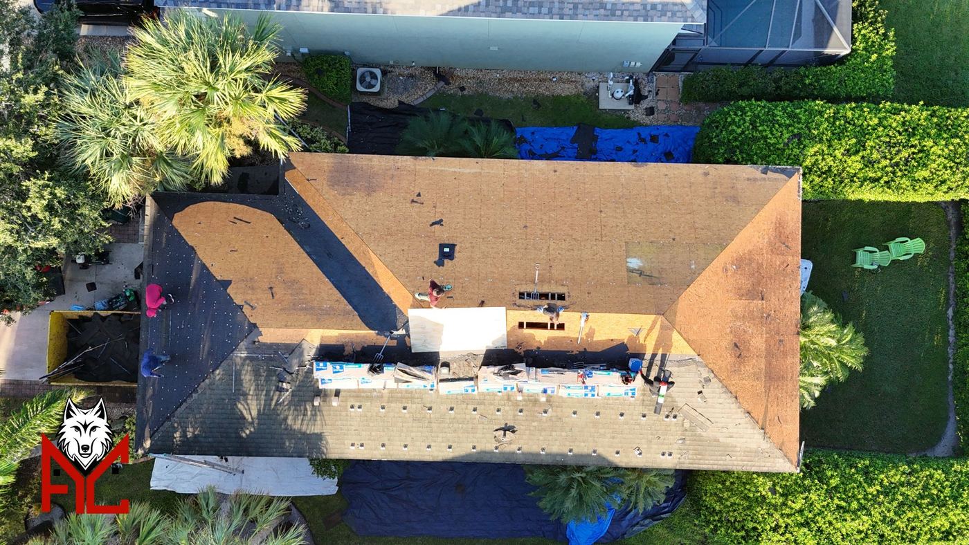 AlphaCore Roofing crew replacing damaged roof decking on a Central Florida home before the new roof system goes on